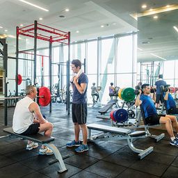 Mature men inside a gym.