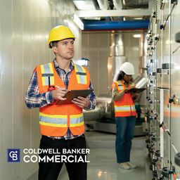 Two Caucasian Worker at an Electrical Panel