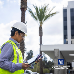 Mature Filipino Man with Tablet Inspecting a Building - Mature Filipino Man with Tablet Inspecting a Building